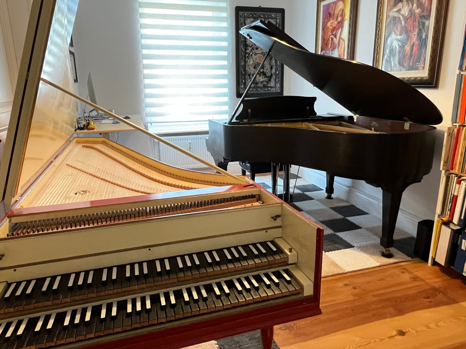 Harpsichord and modern grand side by side, so students can hear baroque touch against romantic tone.